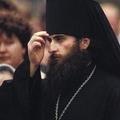 священник